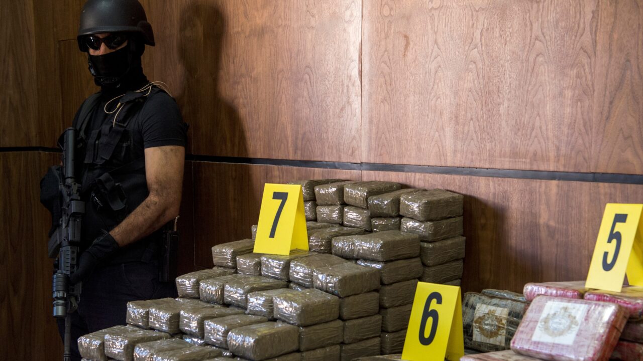 A picture taken on October 4, 2017, shows seized drugs and weapons on display at the Central office of Criminal investigation in the Moroccan city of Marrakesh. / AFP PHOTO / FADEL SENNA